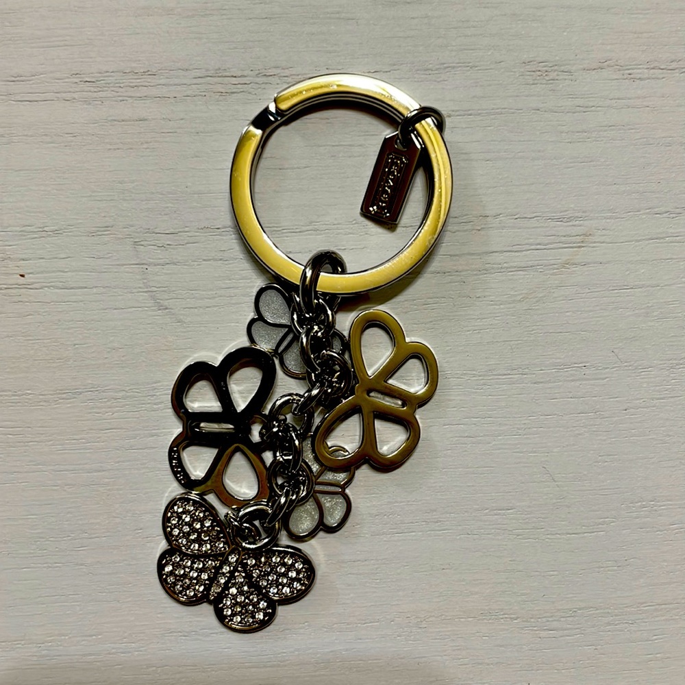 Coach keyring butterfly. New without tags. Dust bag included.